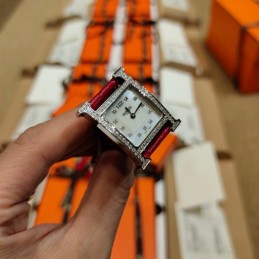 Replica Hermes red leather watch with diamond bezel and hardware options