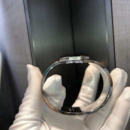 Replica Hermes silver tone wide H cuff bracelet with polished finish