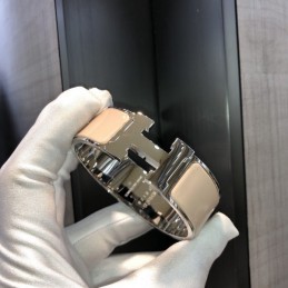 Replica Hermes silver tone wide H cuff bracelet with polished finish