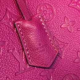 Replica Louis Vuitton Fuchsia Embossed Monogram Montaigne MM with Grained Finish