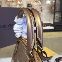 Replica Louis Vuitton Champagne Embossed Monogram Alma BB